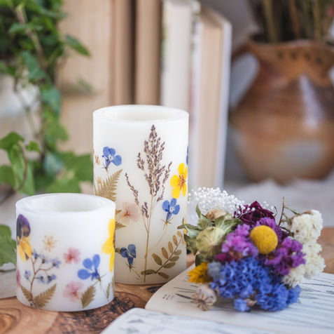 A hurricane candles with pressed flowers