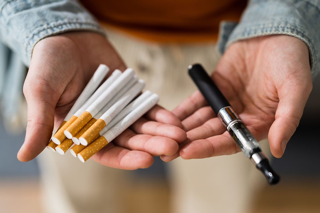 Smoking Tobacco E Cigarette. Holding Tobacco Vape.jpg