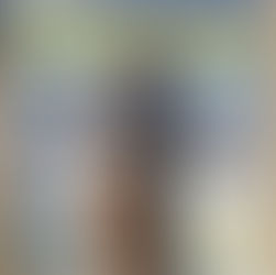 Mysti Bluee posing confidently on the beach in a black and white swimsuit, celebrating her life and legacy as a bold, unapologetic Black queen