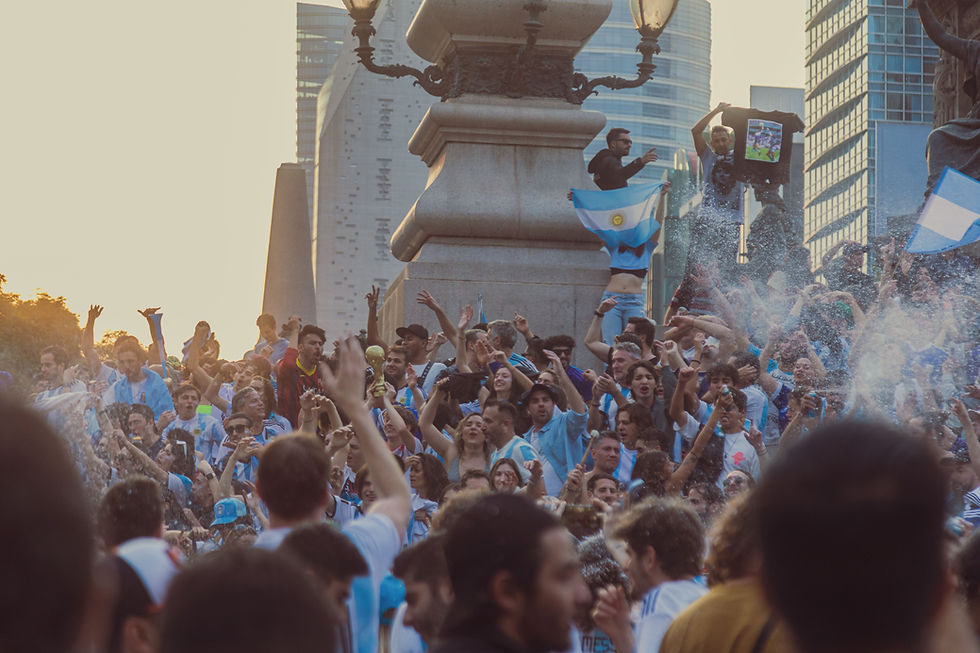 Fans celebrating World Cup victory with flags and drums in city streets