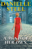 A woman in a red dress walks down a stone street in a 1920's city. She appears to be entirely alone.
