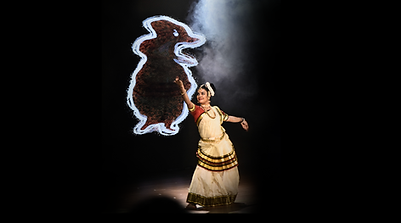 A Mohiniyattam dance performance with AI-generated visuals exploring conflict, memory and war.