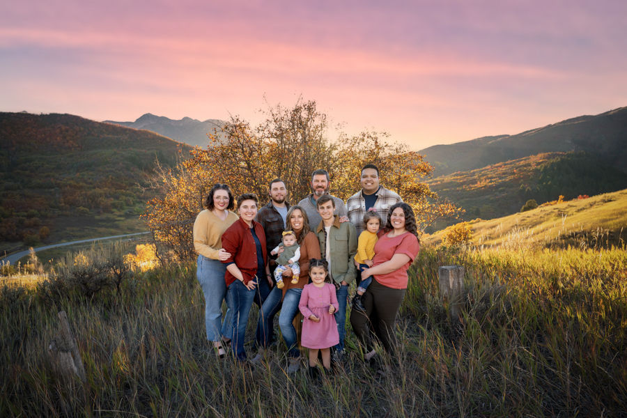 Extended family standing together in the mountains during family location portraits in Utah