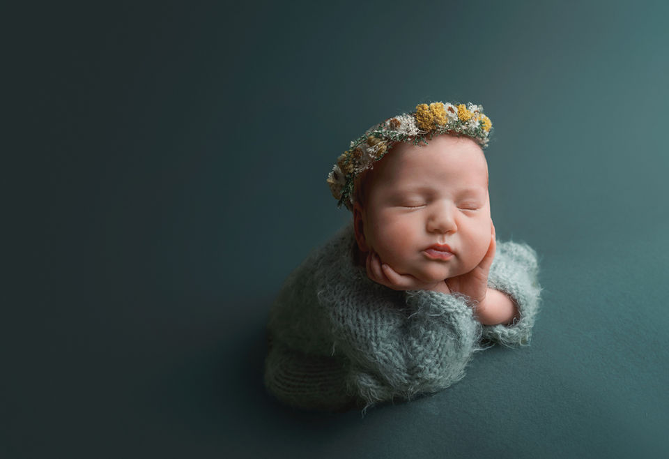 Sleeping newborn portrait in soft blue styling at La Bella Sole Photography