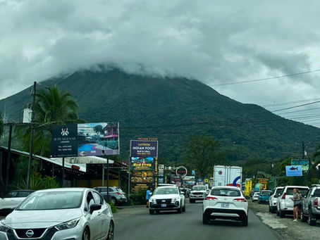 Driving in La Fortuna Costa Rica with Arenal Volcano in the background
