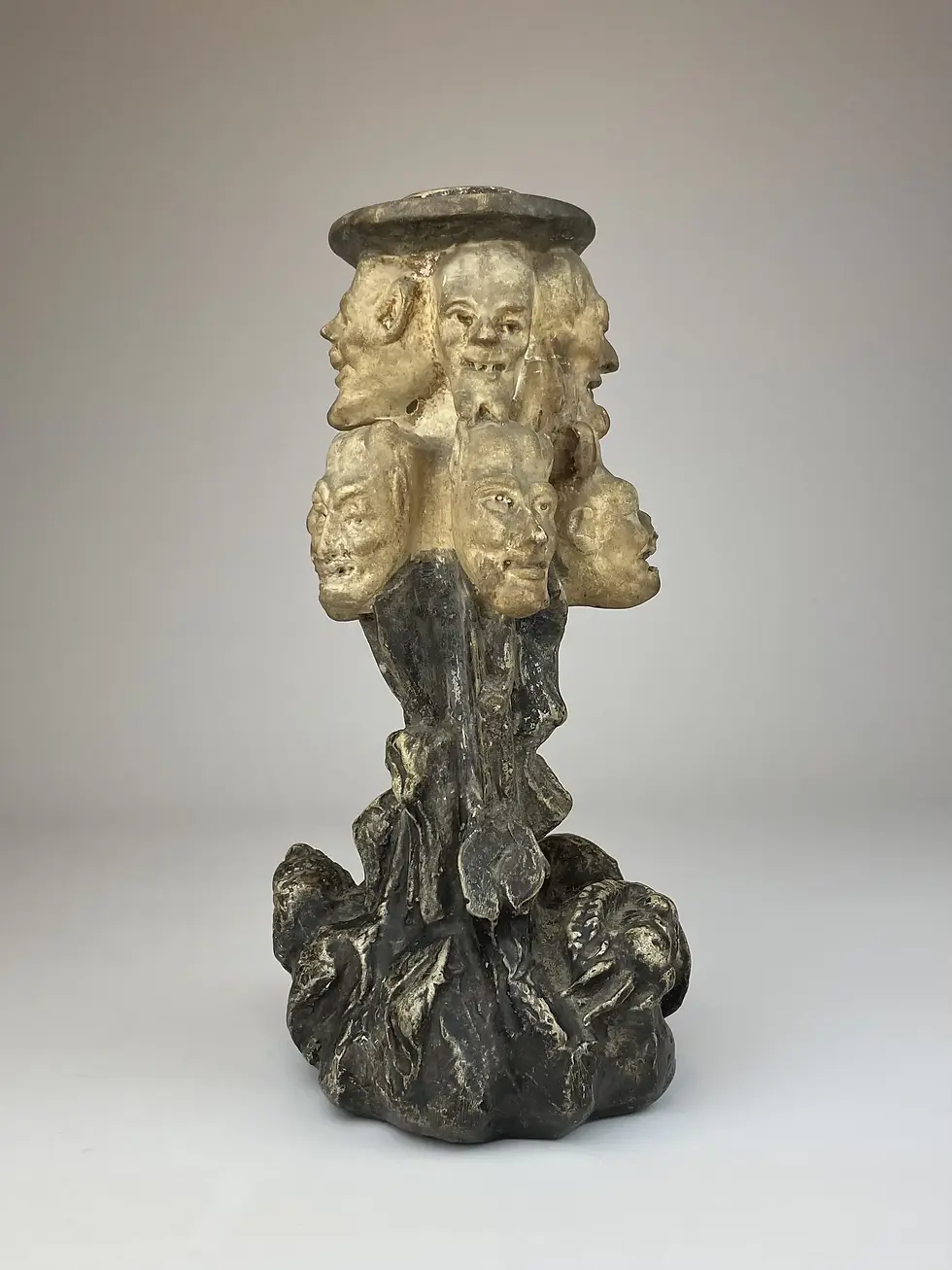 ANTIQUE DEVIL HEAD CANDLESTICK