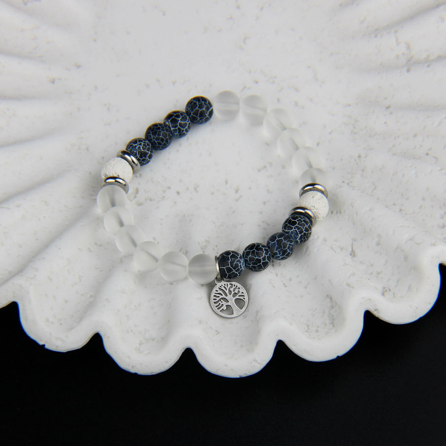 Arbre de vie sur bracelet en pierres naturelles et perle en verre transparent