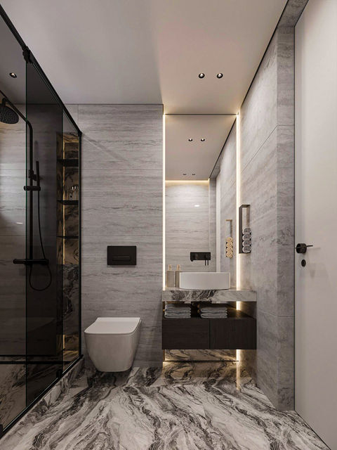 Modern bathroom with marble-effect flooring, illuminated mirror, floating sink cabinet, and built-in storage niches. Warm linear lighting adds depth to the stone textures. sence architects