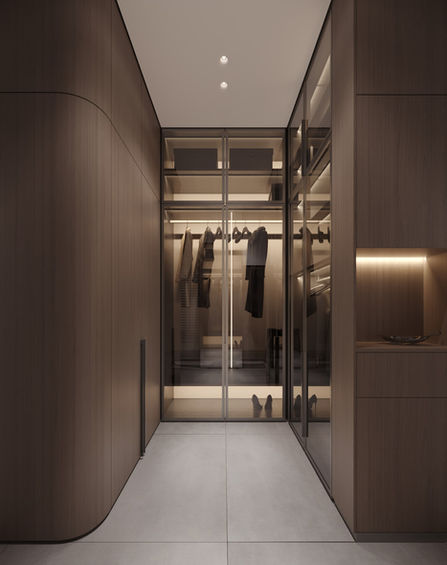 Modern walk-in closet with glass shelving and wooden accents