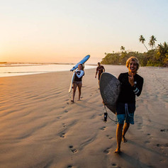 surfers_at_the_beach_sunset_costa_rica.jpeg