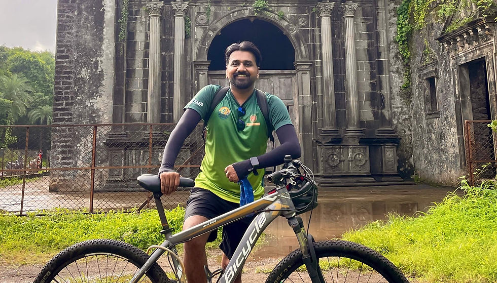 Eye-level view of lone cyclist riding on empty Mumbai coastal road at sunrise