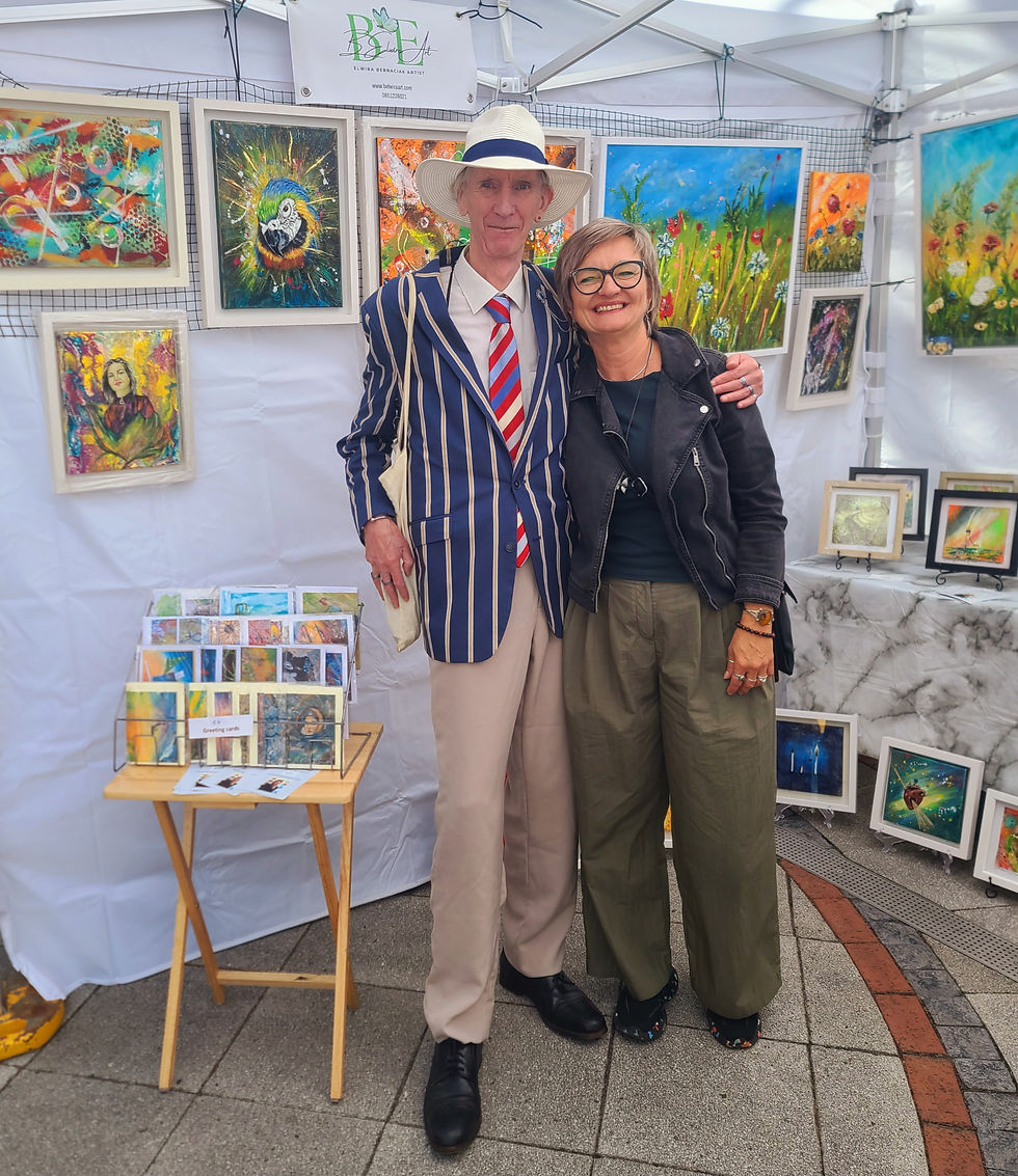 Eye-level view of vibrant art exhibition space at Market Cross Shopping Centre with colourful paintings on display