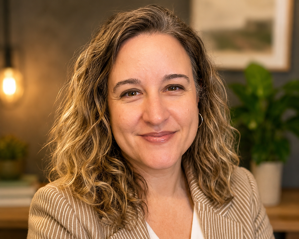 Smiling woman with wavy blonde hair in a striped blazer