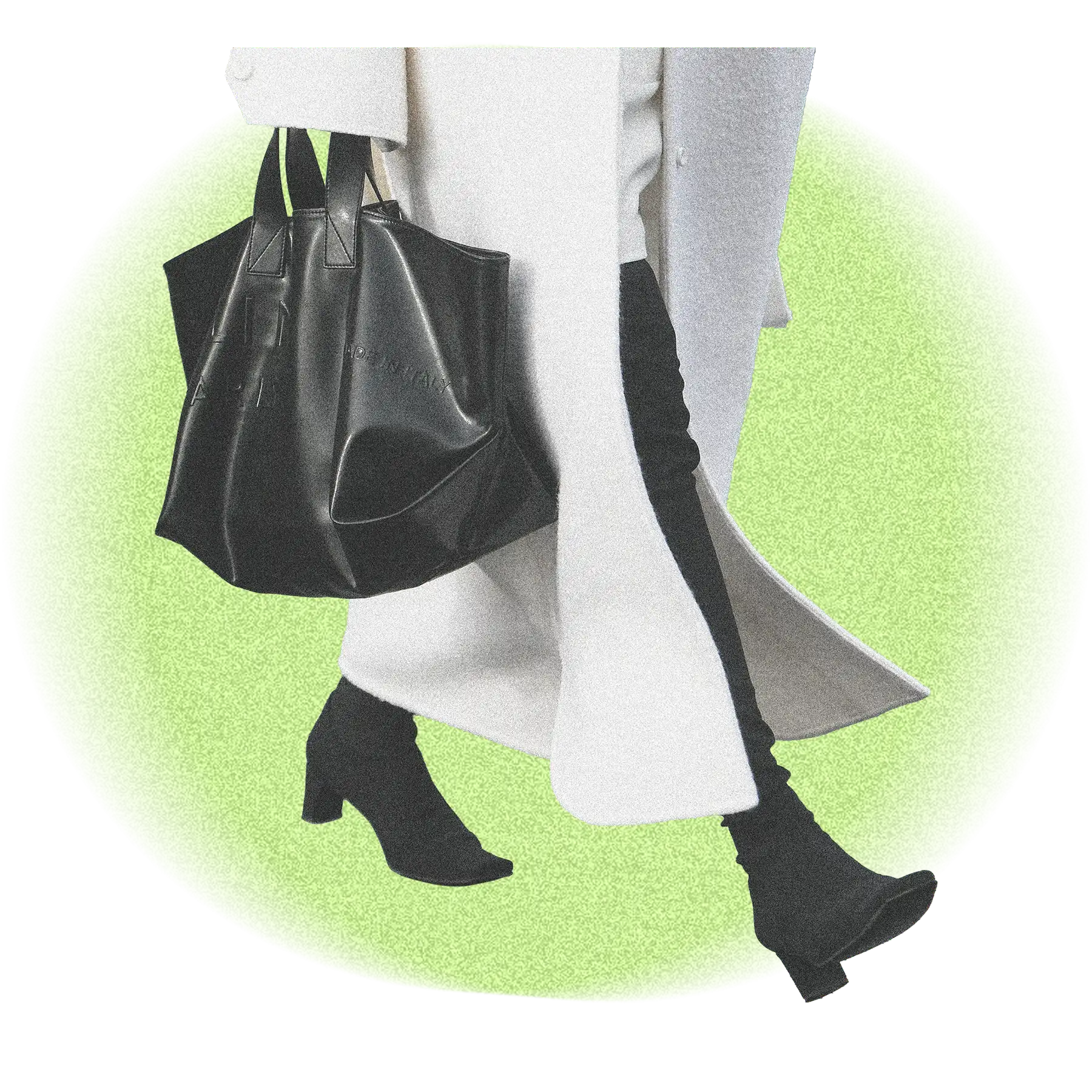 Stylish woman from the waist down with a long coat and tote bag