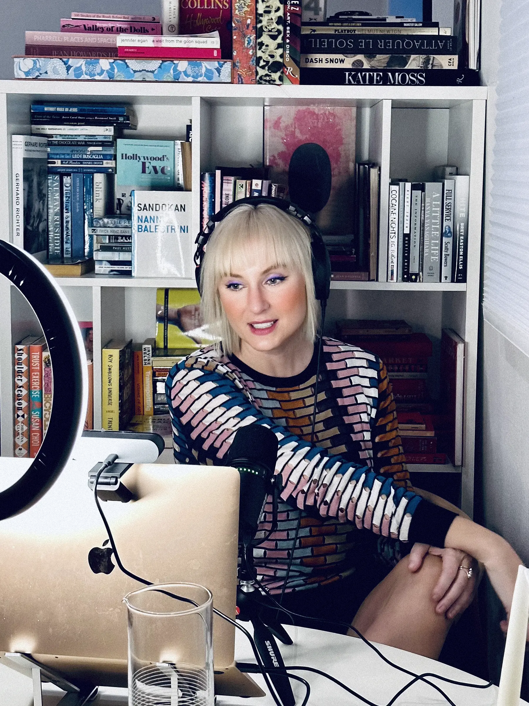 Podcast host talking into monitor