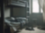 Interior of a negligent rehab residence bedroom with bunkbeds