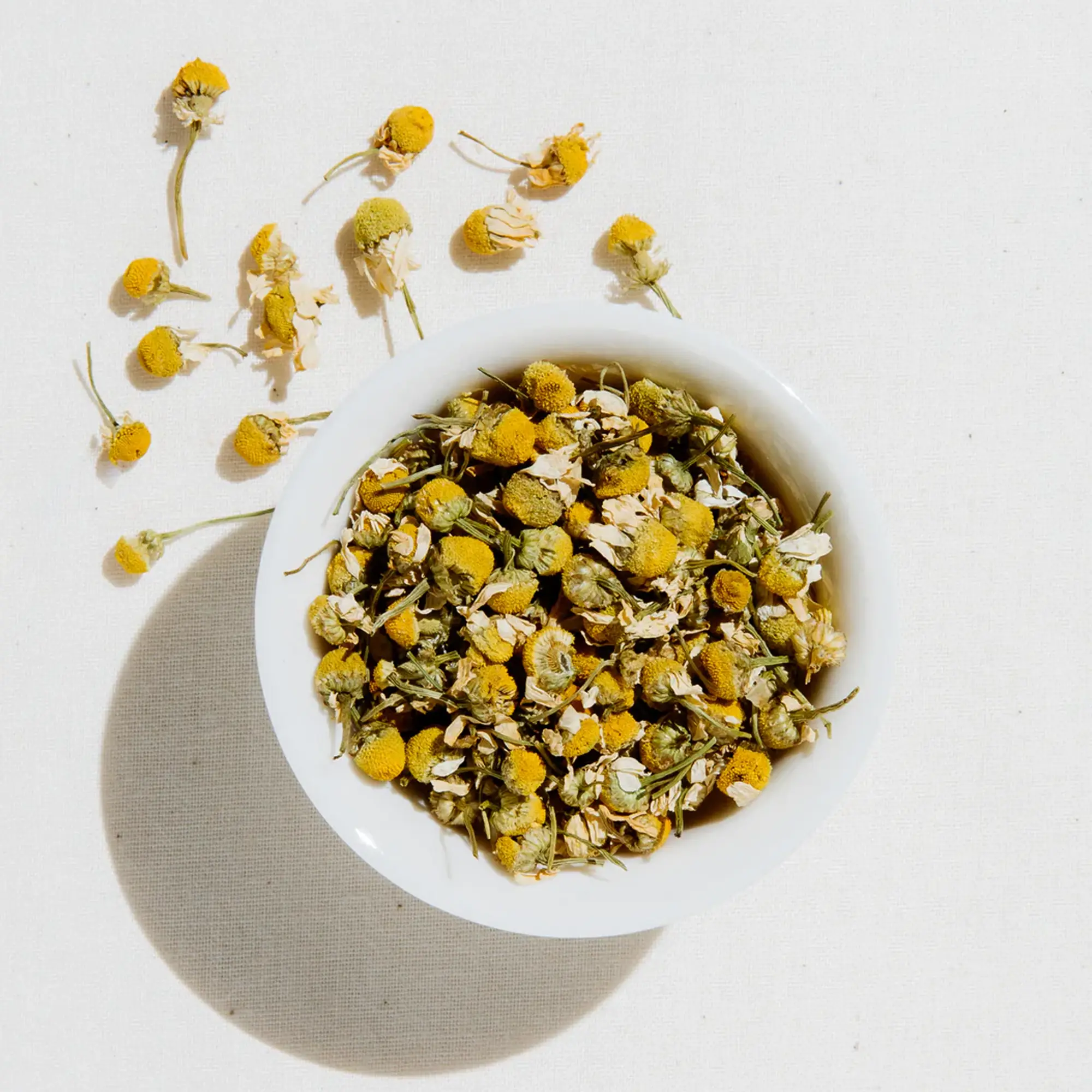 Loose leaf chamomile tea in a bowl