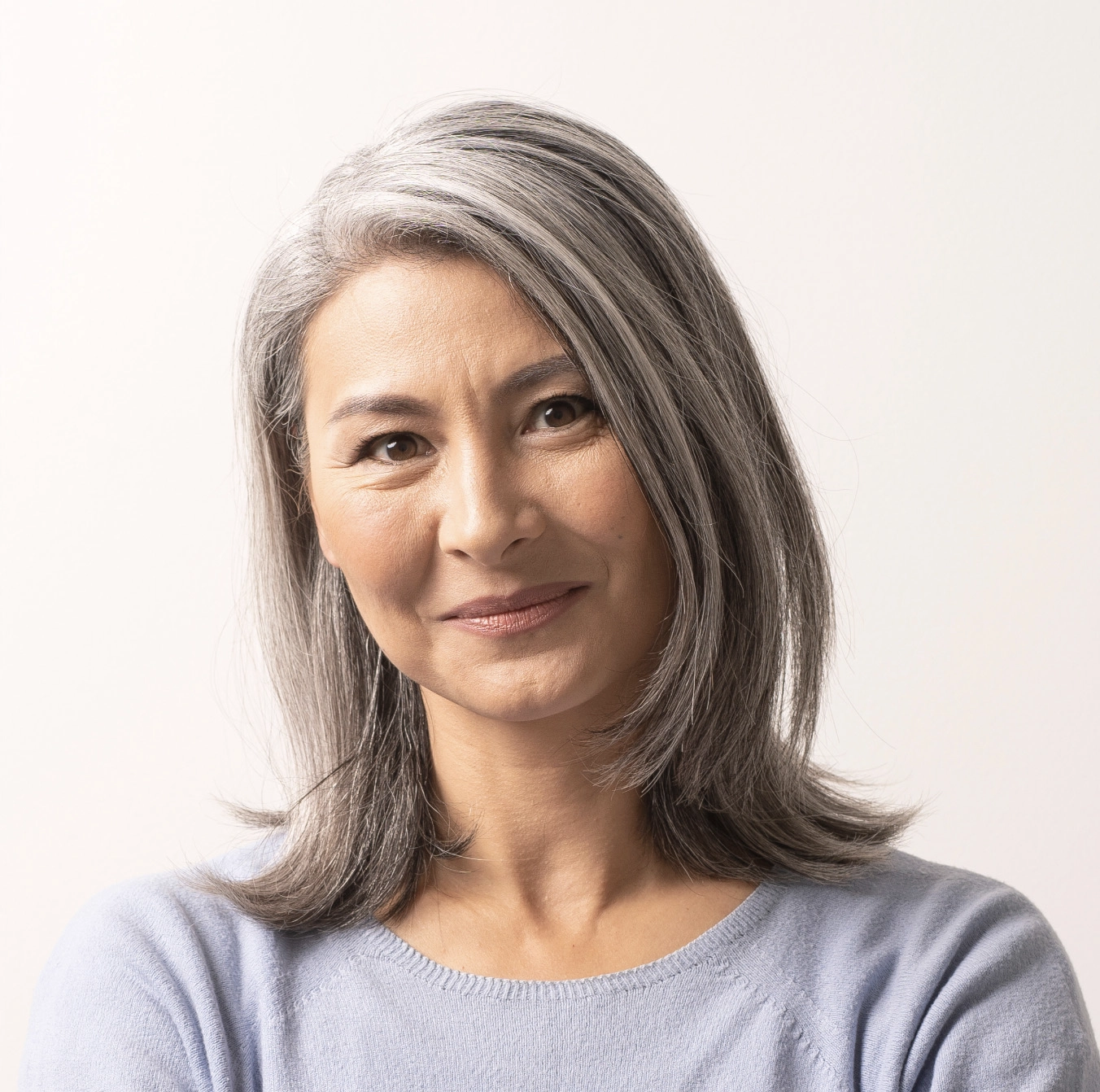 Smiling woman with grey hair