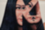 Fractured image of a woman's face