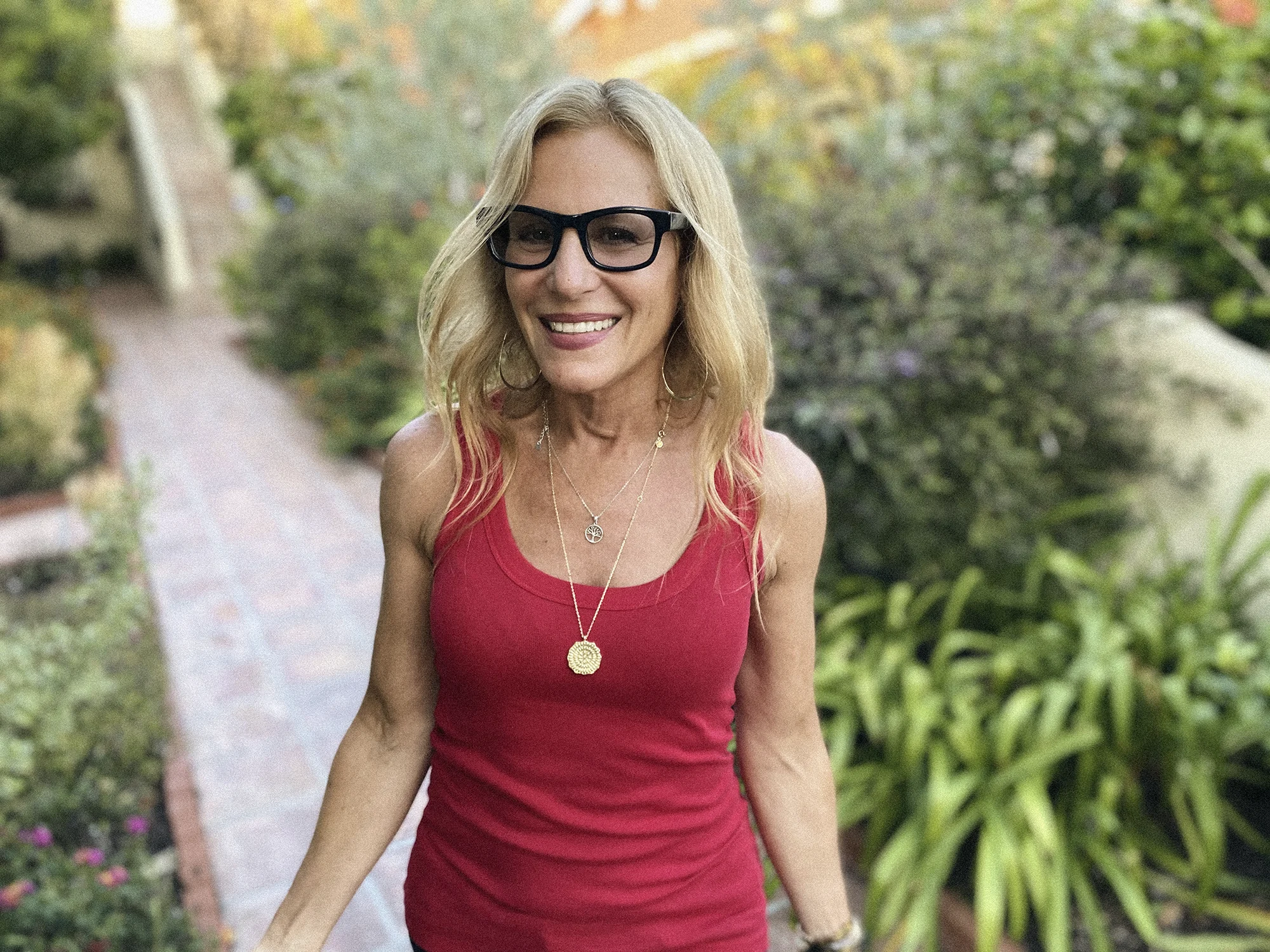 Healthy woman smiling in a garden