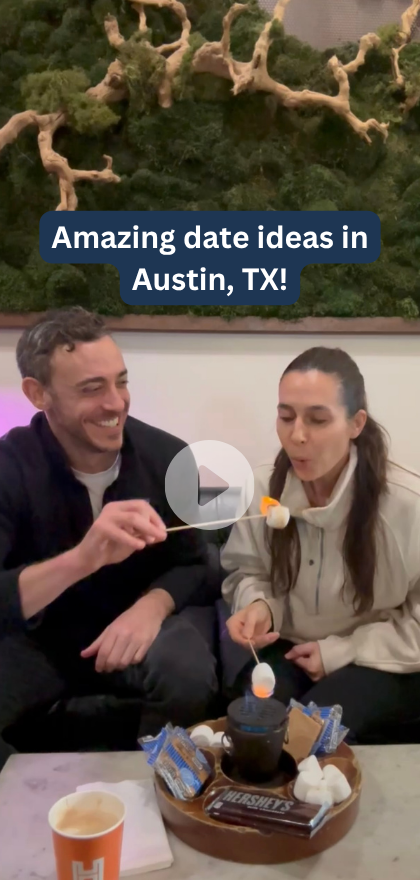 Woman blowing out a marshmallow on fire on a date in Austin, Texas
