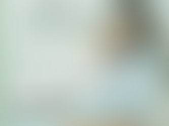 A pregnant woman sitting on a sofa looking unwell and fatigued, illustrating the struggle of managing autoimmune flares and joint pain during pregnancy.