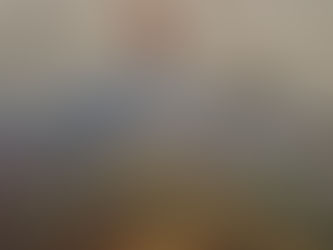 Aerial view from an airplane wing over fields and a city, symbolizing gaining perspective and returning after bipolar depression and ADHD.