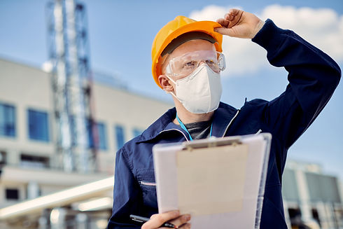 albino-civil-engineer-with-face-mask-inspecting-ongoing-project-construction-site.jpg