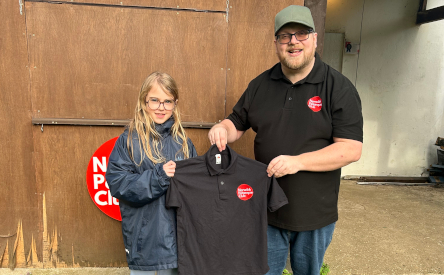 Molly being presented her Shirt by Coach Mark Bell