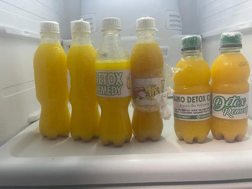 6 bottles filled with doctor ojamo herbal product and detox cleansing