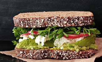 Sandwich with arugula and avocado