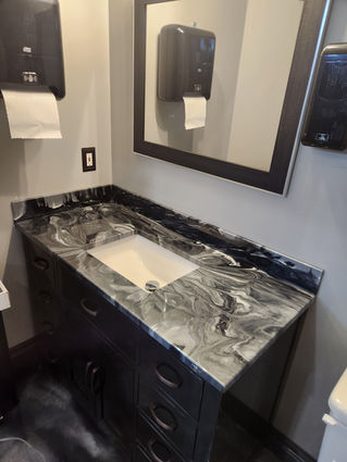 Metallic epoxy countertop in black, white, and silver