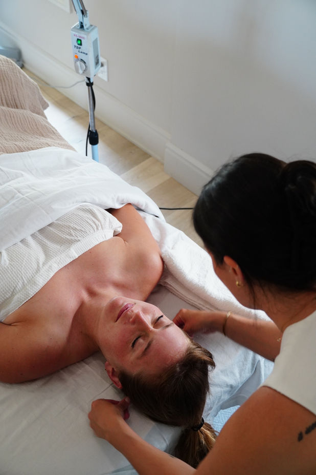 Woman receiving acupuncture treatment