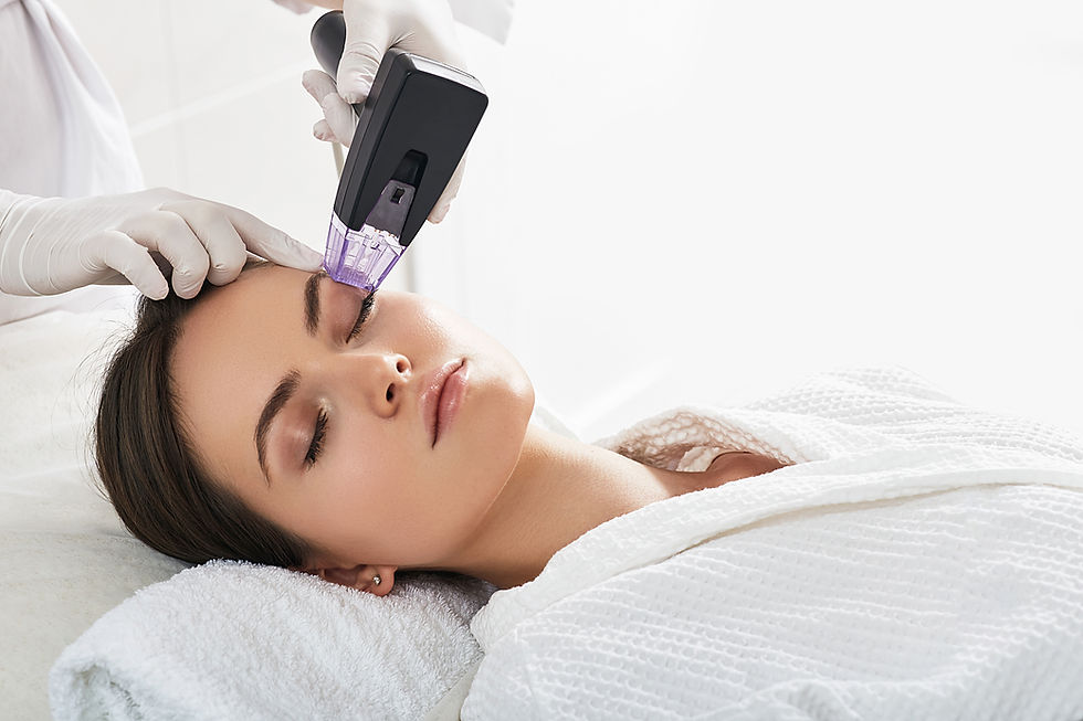 Woman receiving a professional laser facial treatment.