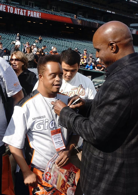 Man signing Giants jersey at AT&T Park