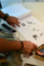 Designer reviewing home design plans and samples