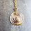 Thumbnail: Transparent Pink Glass Disc and Gold Leaf Necklace