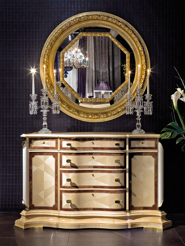 Maple chest of drawers
with white marble and brass
details.