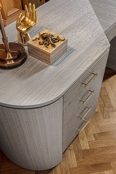 Bird’s eye maple and frisè eucalyptus chest of drawers with brass handle.