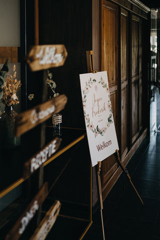 Welkomstbord in stijl van uw huwelijksuitnodiging