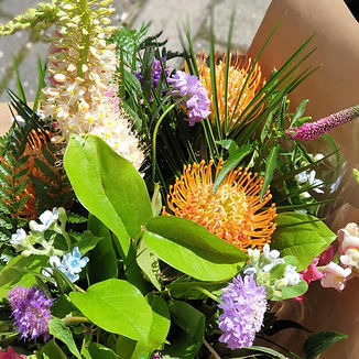 Scabious, veronica, love in the mist, leucospermum, eremirus, salal