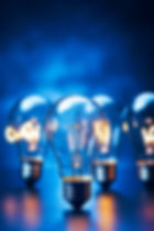 group-light-bulbs-sitting-top-blue-counter-top-each-other-generative-ai.jpg