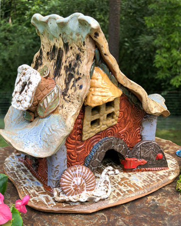 Levi Hibiscus House by Back to the Mud Pottery