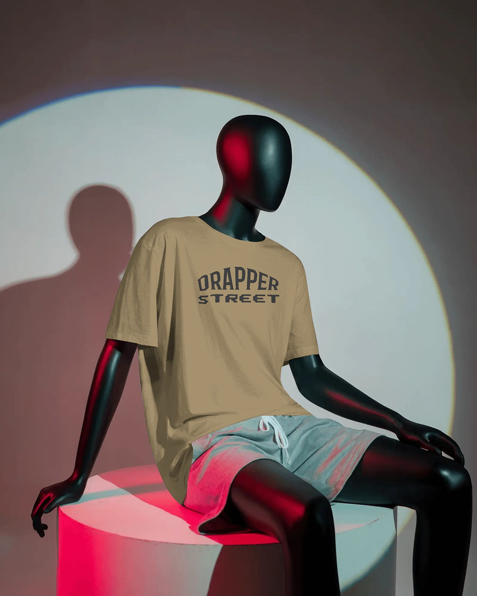 studio-lit-unisex-t-shirt-mockup-minimalistic-seated-pose-on-white-cylinder-podium-in-colo