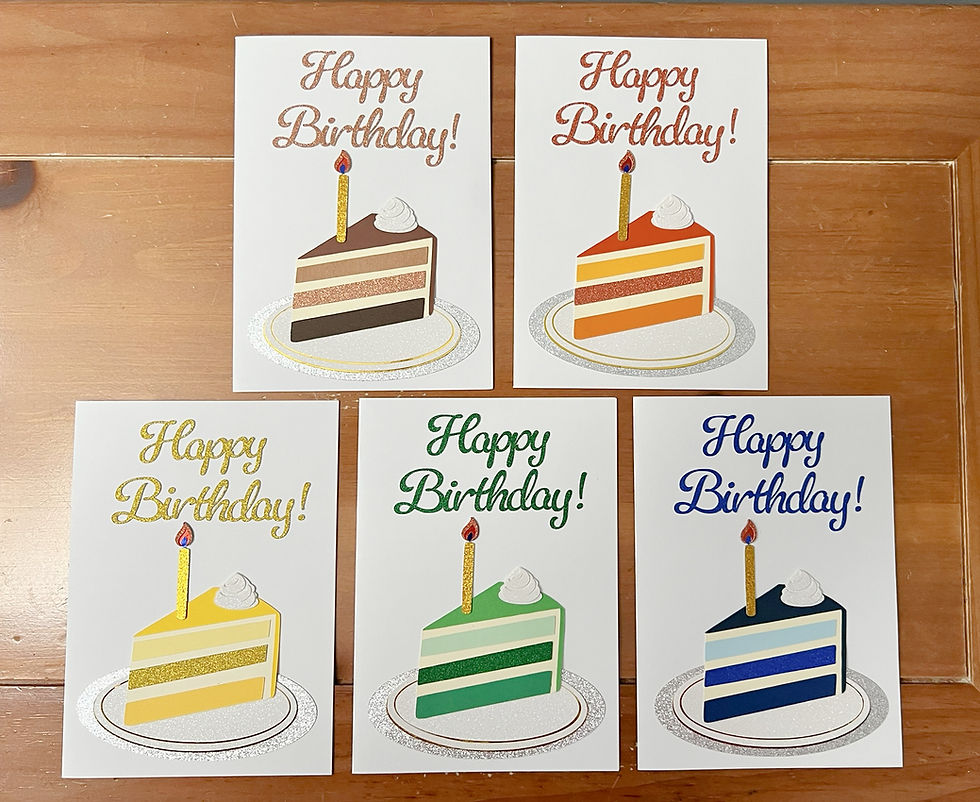 Five donated handmade birthday cards featuring cake slices in blue, green, yellow, orange, and brown with sparkling details and Happy Birthday! lettering.