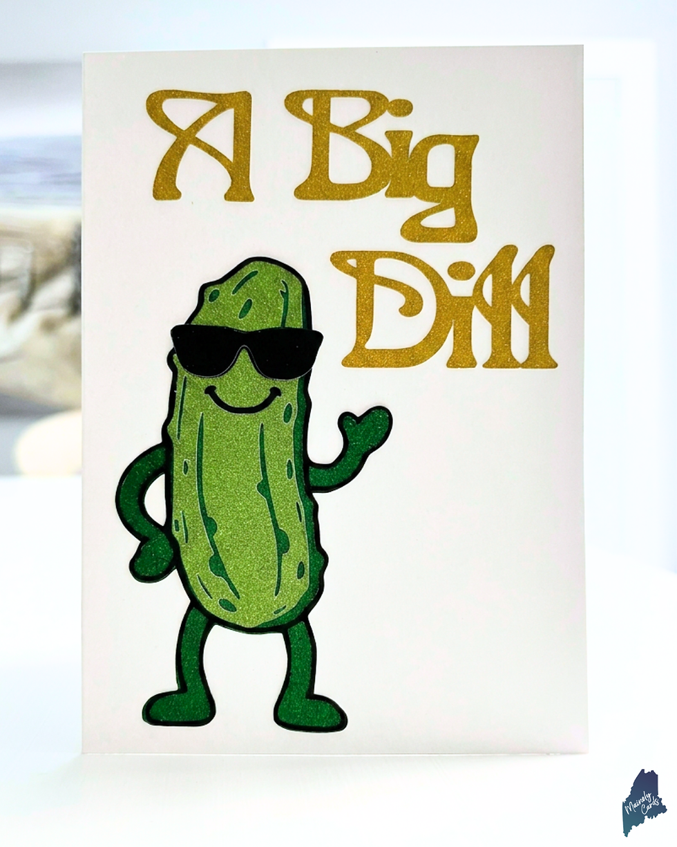 Production-ready A Big Dill greeting card featuring Kirby, a dimensional layered paper pickle with black glitter sunglasses, gold glitter lettering, and a friendly wave.