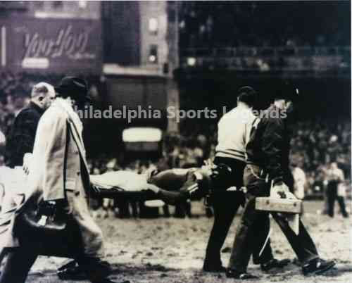 Frank Gifford carried on stretcher from hit by Eagles Chuck Bednarik