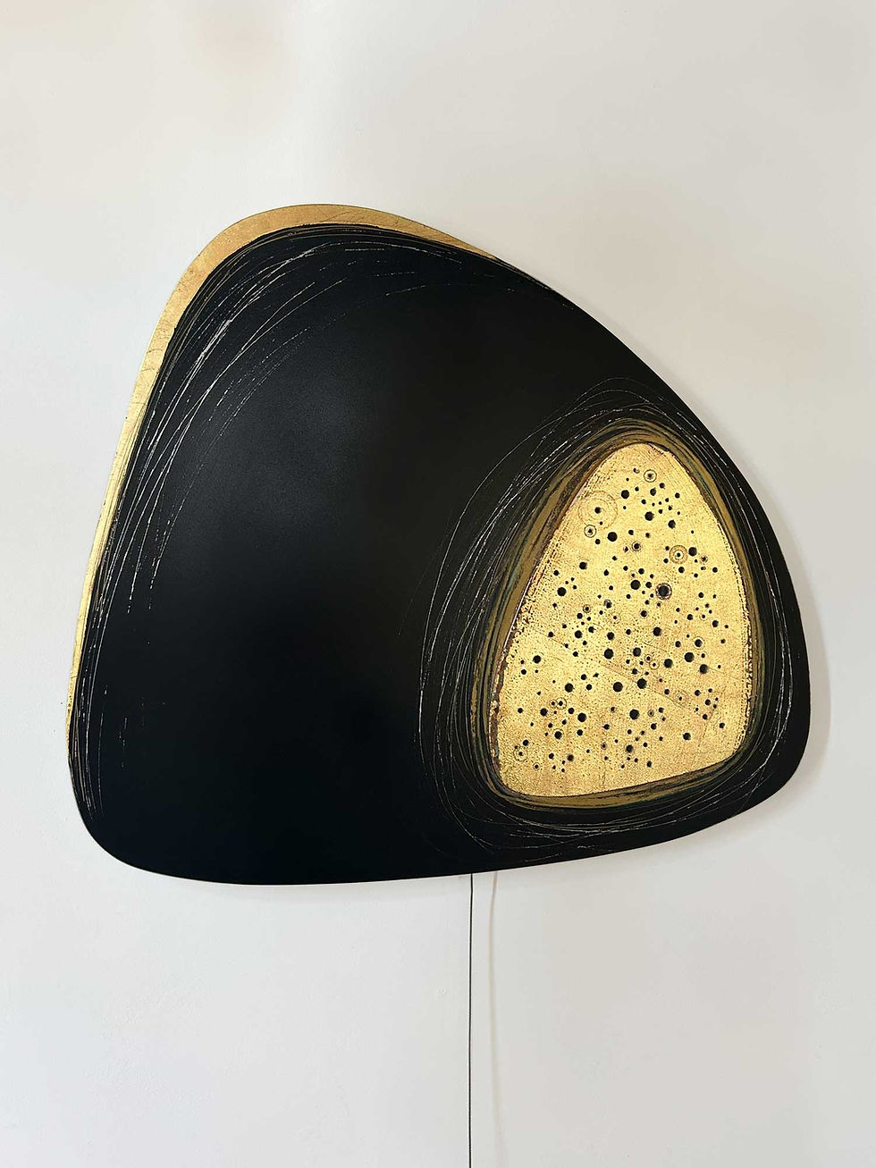 Thumbnail: Black and Gold Triangular Shape with Holes