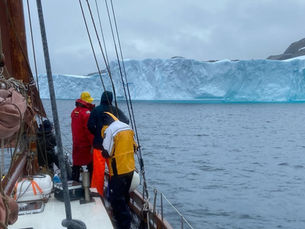 On a sailboat looking at Greenland