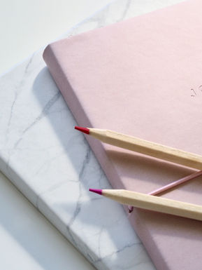 Pink journal, 'JOURNAL' embossed, with two pencils